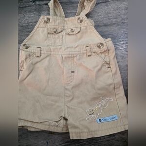 First Moments Layette tan overall shorts with frog embroidery. 3-6 months
